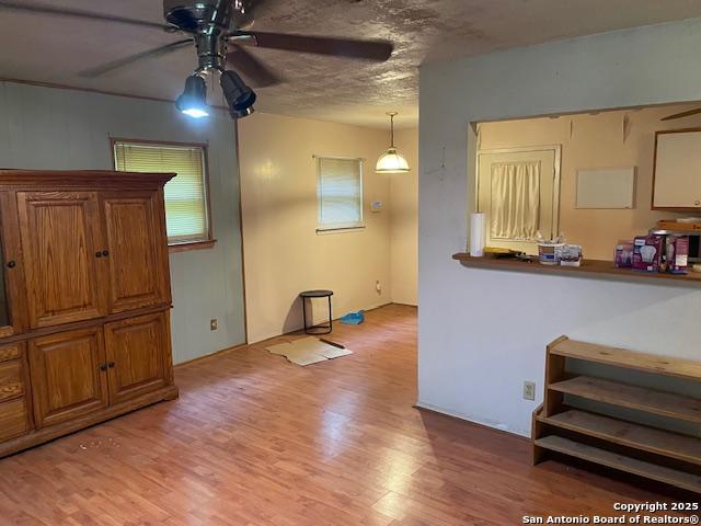 12315 Royal Grn, Conroe, TX 77303 - living area with a ceiling fan and light wood-type flooring