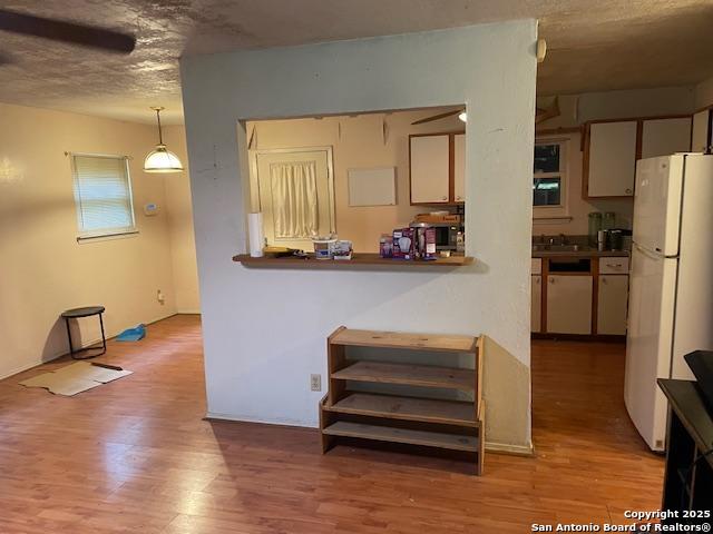 12315 Royal Grn, Conroe, TX 77303 - kitchen with white appliances and wood finished floors