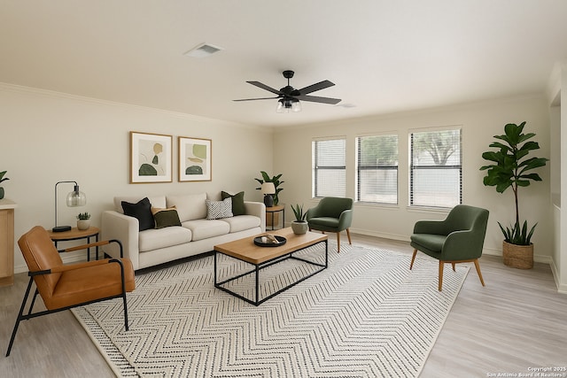 16063 Walnut Crk, San Antonio, TX 78247 - living area featuring light wood-style flooring, ceiling fan, and crown molding