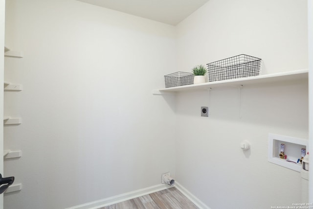 16063 Walnut Crk, San Antonio, TX 78247 - washroom featuring hookup for an electric dryer, hookup for a washing machine, and light wood finished floors