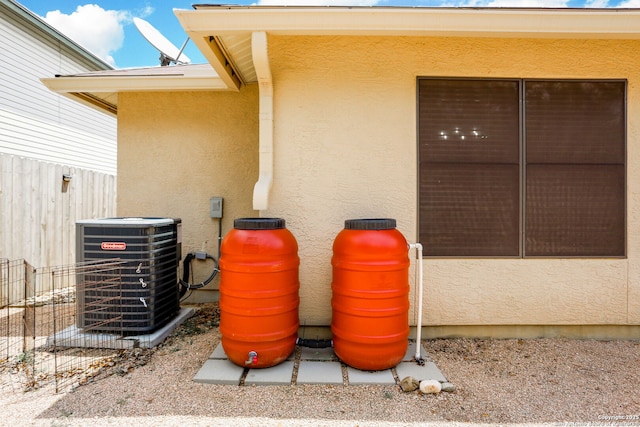 16063 Walnut Crk, San Antonio, TX 78247 - exterior view of a central air condition unit and stucco siding