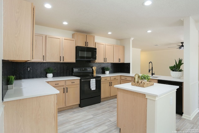 16063 Walnut Crk, San Antonio, TX 78247 - kitchen featuring black appliances, light brown cabinetry, a peninsula, tasteful backsplash, and recessed lighting