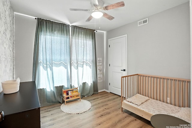619 Olney Dr, San Antonio, TX 78209 - bedroom with wood finished floors and a ceiling fan