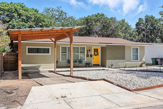 619 Olney Dr, San Antonio, TX 78209 - view of front of house featuring a carport and a shingled roof