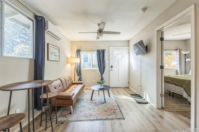 619 Olney Dr, San Antonio, TX 78209 - foyer entrance featuring a wall mounted air conditioner, a ceiling fan, and light wood-style flooring