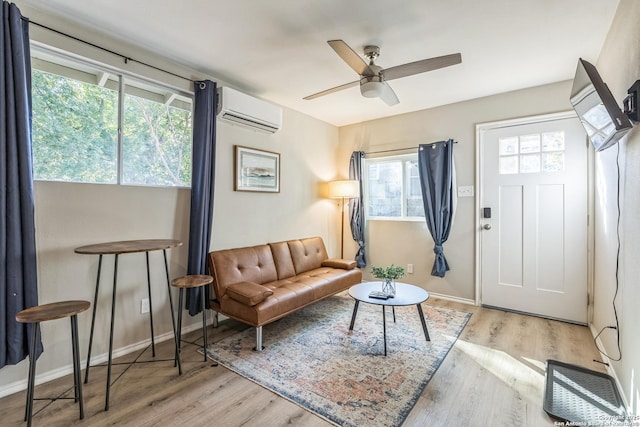 619 Olney Dr, San Antonio, TX 78209 - living area featuring a wall unit AC, wood finished floors, and ceiling fan