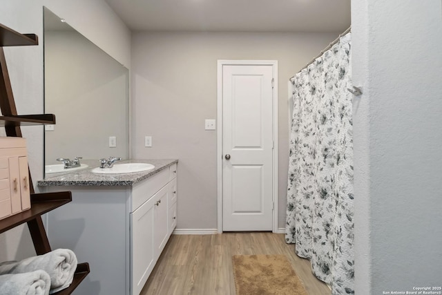 5331 Fair Moon, Bulverde, TX 78163 - bathroom featuring wood finished floors, double vanity, and a shower with shower curtain