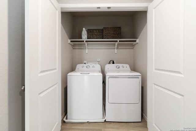 5331 Fair Moon, Bulverde, TX 78163 - laundry area with independent washer and dryer and light wood-style flooring