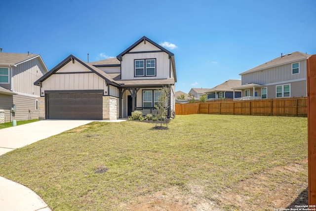 27422 Bighorn Sheep, Boerne, TX 78015 - view of front of house with covered porch, an attached garage, concrete driveway, stone siding, and roof with shingles