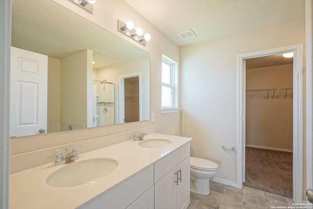 27422 Bighorn Sheep, Boerne, TX 78015 - full bathroom featuring double vanity, a spacious closet, and a shower
