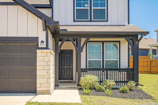 27422 Bighorn Sheep, Boerne, TX 78015 - doorway to property featuring board and batten siding, a garage, and stone siding