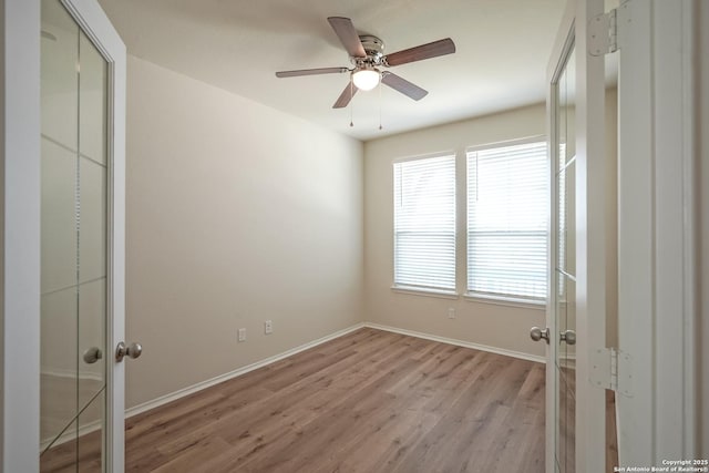 27422 Bighorn Sheep, Boerne, TX 78015 - unfurnished bedroom with french doors, wood finished floors, ceiling fan, and a closet