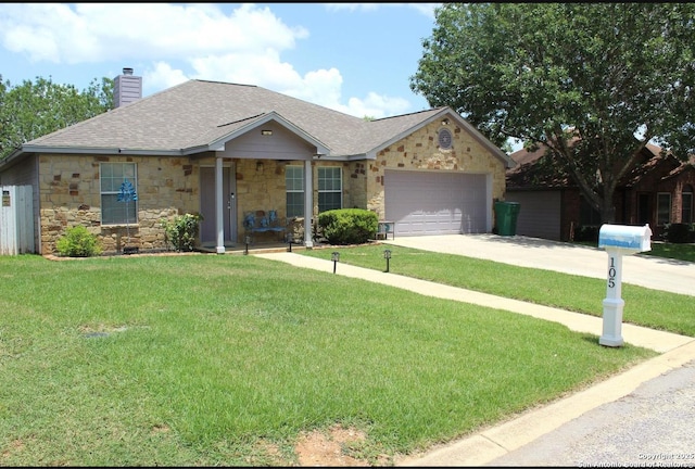 105 Yucca, Jourdanton, TX 78026 - single story home featuring stone siding, driveway, a front yard, a chimney, and a garage