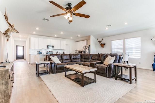 8030 Chanting, San Antonio, TX 78223 - living room featuring light wood-type flooring, a ceiling fan, and recessed lighting
