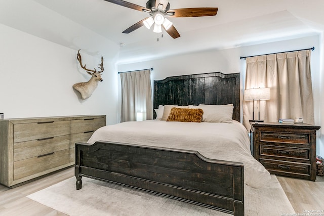 8030 Chanting, San Antonio, TX 78223 - bedroom with light wood finished floors and ceiling fan