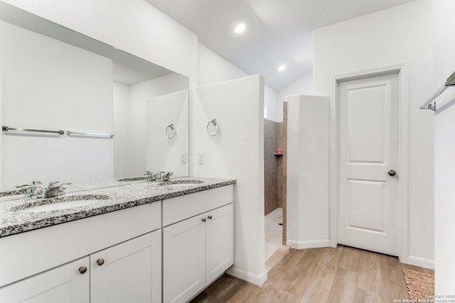 8030 Chanting, San Antonio, TX 78223 - full bath with wood finished floors, double vanity, walk in shower, recessed lighting, and vaulted ceiling