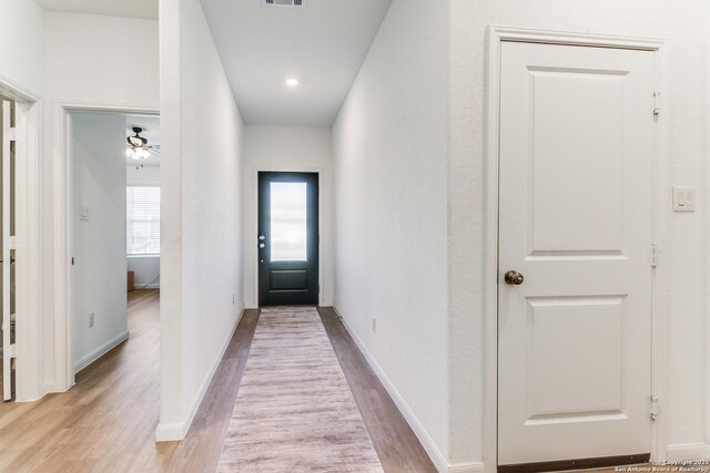 8030 Chanting, San Antonio, TX 78223 - doorway featuring wood finished floors and baseboards