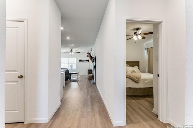 8030 Chanting, San Antonio, TX 78223 - hallway with light wood finished floors