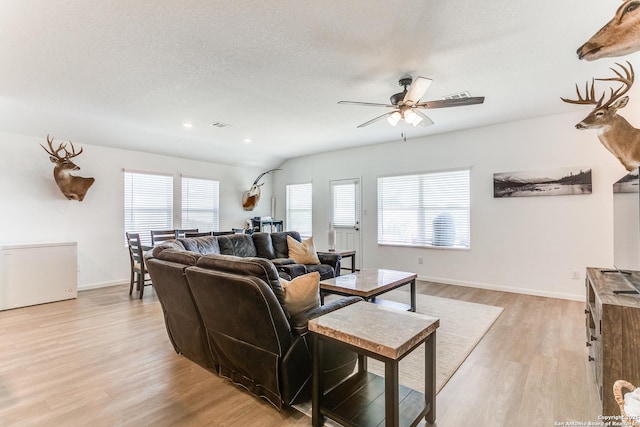 8030 Chanting, San Antonio, TX 78223 - living room with light wood finished floors, ceiling fan, and recessed lighting