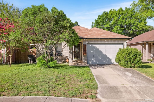 9830 Lauren Mist, San Antonio, TX 78251 - view of front facade featuring an attached garage, a front lawn, driveway, and brick siding