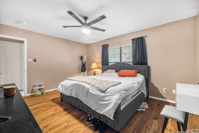 9830 Lauren Mist, San Antonio, TX 78251 - bedroom featuring wood finished floors, ceiling fan, and a textured ceiling