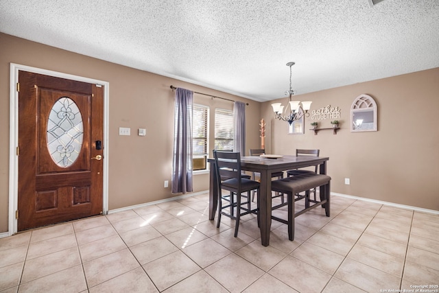 9830 Lauren Mist, San Antonio, TX 78251 - dining area featuring a chandelier, light tile patterned floors, and a textured ceiling
