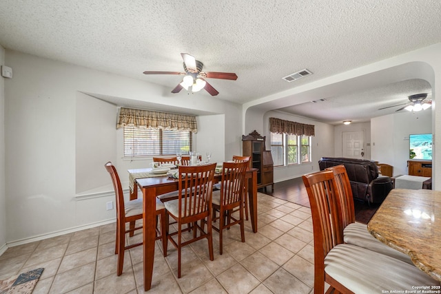 8810 Sebec Cir, San Antonio, TX 78250 - dining space with ceiling fan, a textured ceiling, and light tile patterned floors
