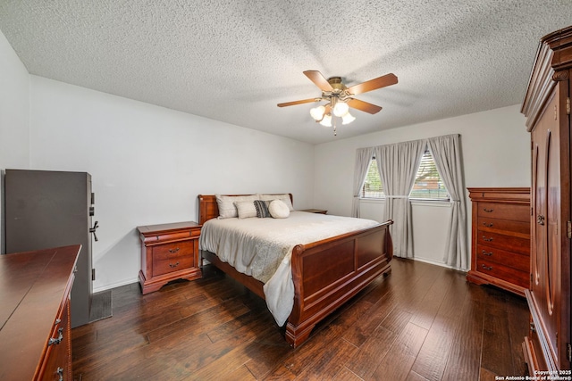 8810 Sebec Cir, San Antonio, TX 78250 - bedroom featuring dark wood-type flooring, a textured ceiling, and a ceiling fan