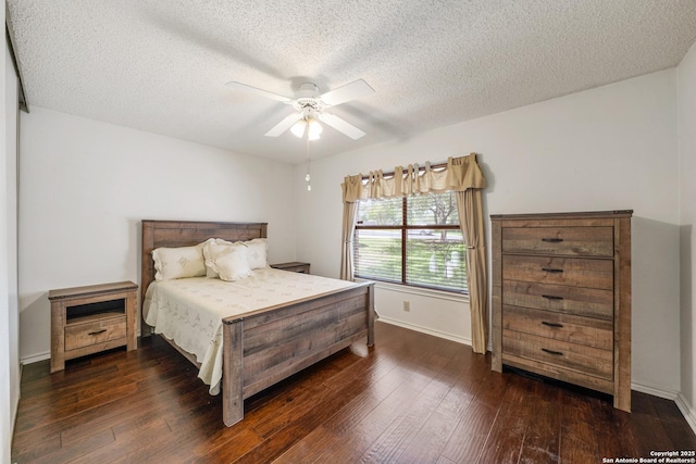 8810 Sebec Cir, San Antonio, TX 78250 - bedroom with dark wood-style flooring, a textured ceiling, and ceiling fan