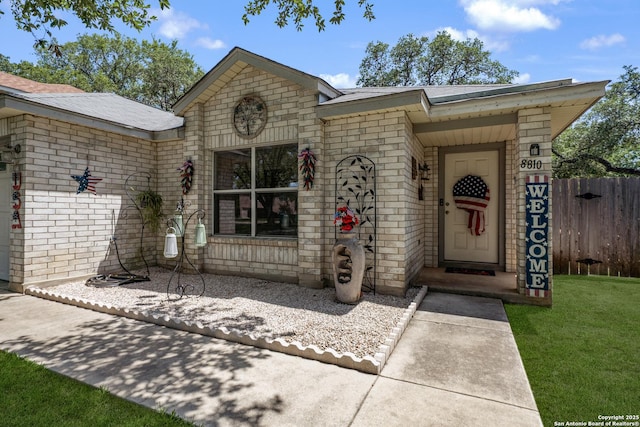 8810 Sebec Cir, San Antonio, TX 78250 - property entrance featuring brick siding and a shingled roof