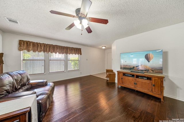 8810 Sebec Cir, San Antonio, TX 78250 - living room with a textured ceiling, ceiling fan, and dark wood-style flooring