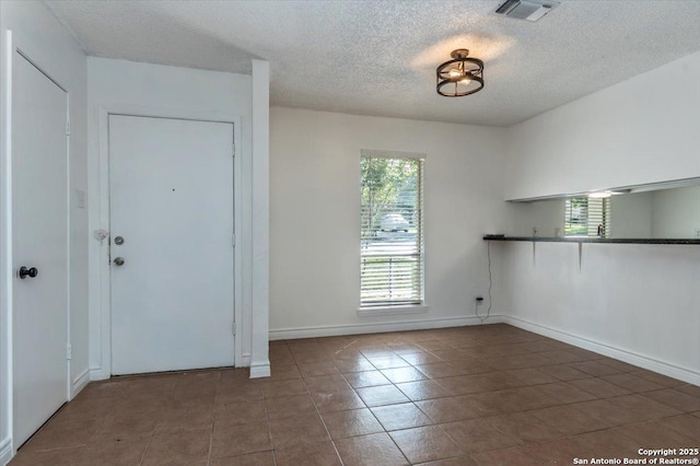 142 Meadow, Converse, TX 78109 - entrance foyer featuring a textured ceiling and tile patterned floors