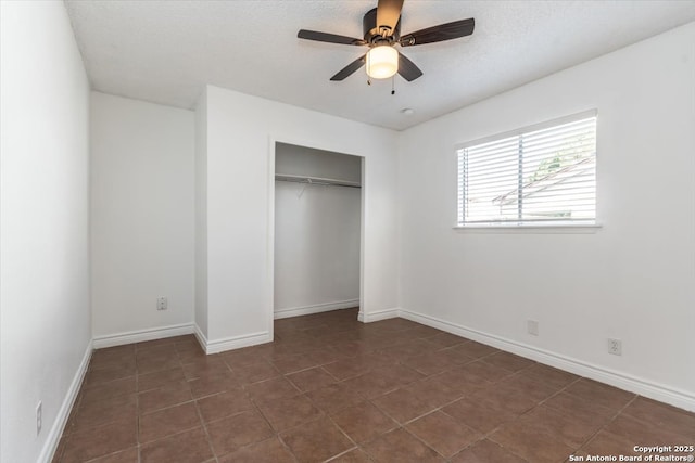 142 Meadow, Converse, TX 78109 - unfurnished bedroom featuring a closet, dark tile patterned floors, and a ceiling fan