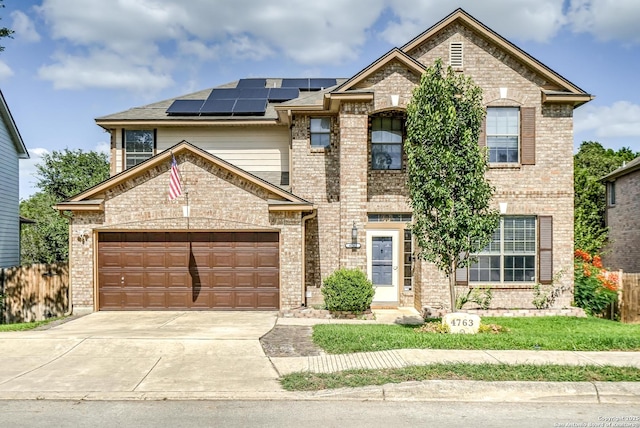 4763 Bending Grv, San Antonio, TX 78259 - french country inspired facade with brick siding, concrete driveway, solar panels, and a garage