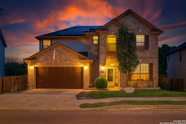 4763 Bending Grv, San Antonio, TX 78259 - traditional-style home featuring solar panels, a garage, driveway, and stone siding