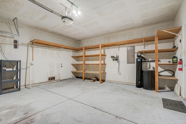 4763 Bending Grv, San Antonio, TX 78259 - garage with electric panel and a garage door opener