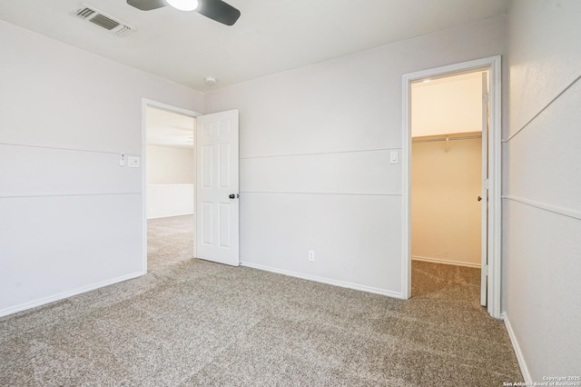 4763 Bending Grv, San Antonio, TX 78259 - unfurnished bedroom featuring a walk in closet, carpet floors, a closet, and ceiling fan