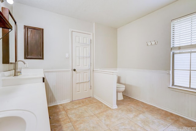 4763 Bending Grv, San Antonio, TX 78259 - full bath with double vanity, wainscoting, and tile patterned flooring