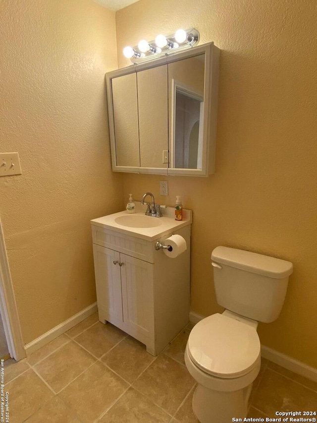 305 Osage, Refugio, TX 78377 - half bath with vanity and tile patterned floors