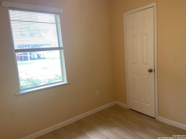 305 Osage, Refugio, TX 78377 - spare room with light wood-type flooring and healthy amount of natural light