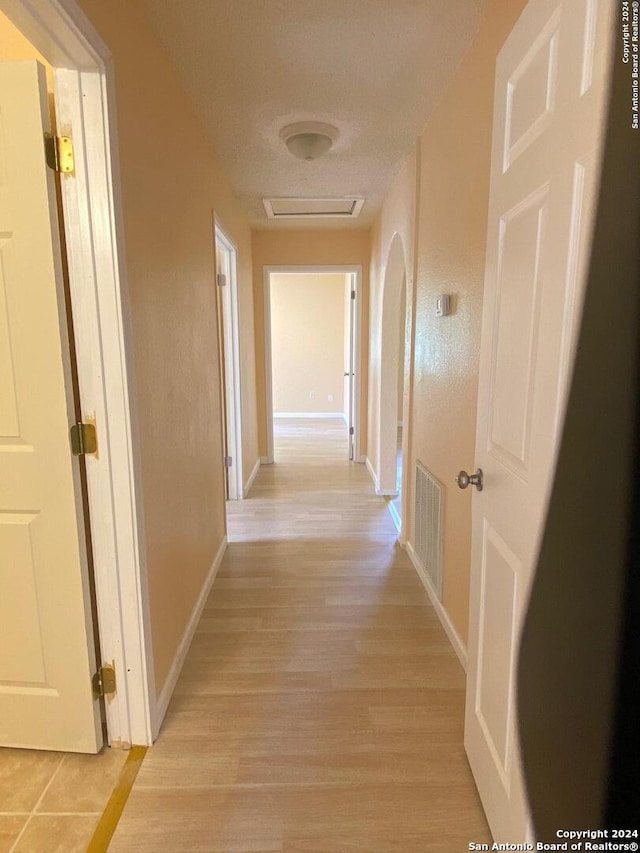 305 Osage, Refugio, TX 78377 - corridor featuring light wood-style flooring