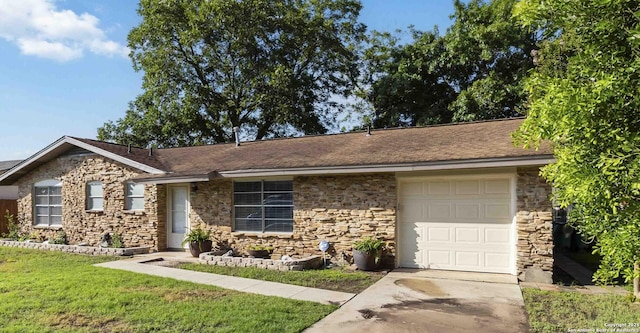 211 Balboa, Universal City, TX 78148 - single story home with stone siding, an attached garage, concrete driveway, and a front yard