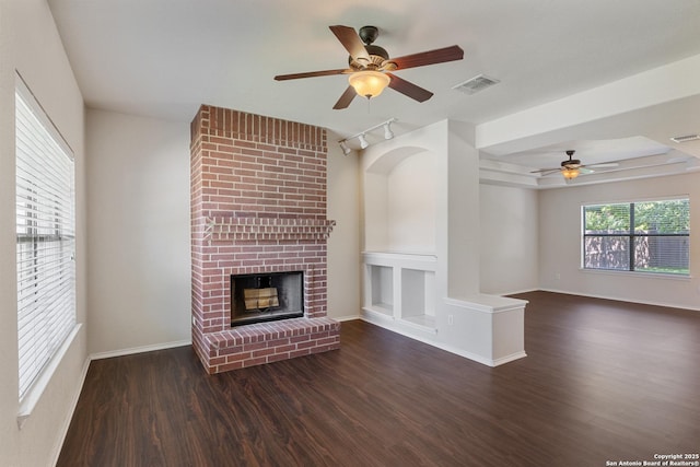 5614 Cross Pond, San Antonio, TX 78249 - unfurnished living room featuring ceiling fan, wood finished floors, and a brick fireplace