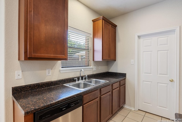 5614 Cross Pond, San Antonio, TX 78249 - kitchen with stainless steel dishwasher, dark countertops, light tile patterned floors, and brown cabinets