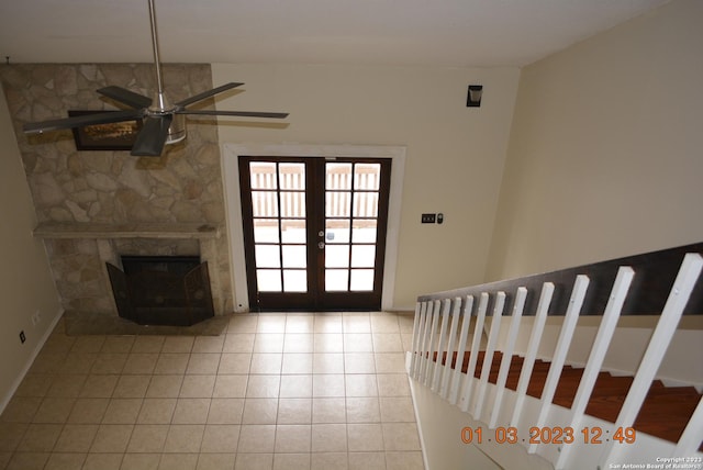 4107 Medical Dr Unit 8204, San Antonio, TX 78229 - entryway featuring a ceiling fan, tile patterned flooring, french doors, and a fireplace