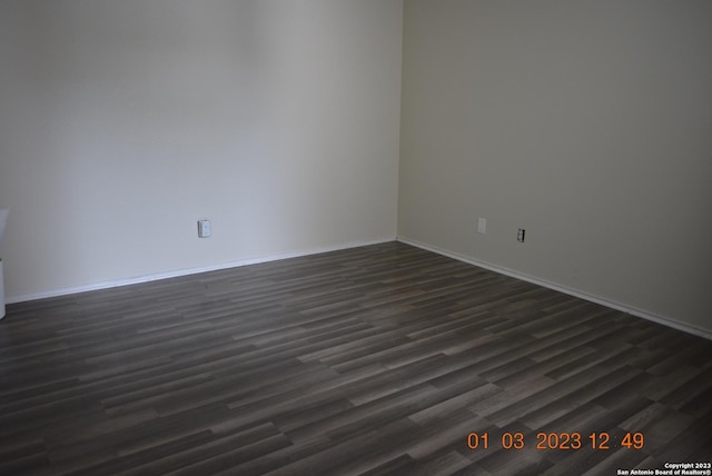 4107 Medical Dr Unit 8204, San Antonio, TX 78229 - unfurnished room with dark wood-style flooring and baseboards