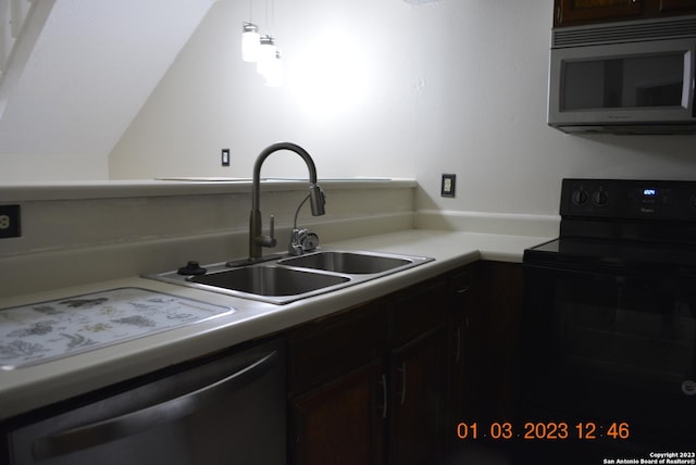 4107 Medical Dr Unit 8204, San Antonio, TX 78229 - kitchen featuring black electric range, stainless steel microwave, dishwasher, light countertops, and dark brown cabinets