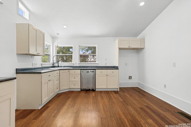 110 Vitra, San Antonio, TX 78210 - kitchen with stainless steel dishwasher, dark countertops, dark wood finished floors, recessed lighting, and hanging light fixtures