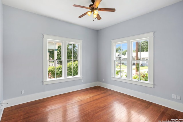 110 Vitra, San Antonio, TX 78210 - unfurnished room with plenty of natural light, wood-type flooring, and ceiling fan