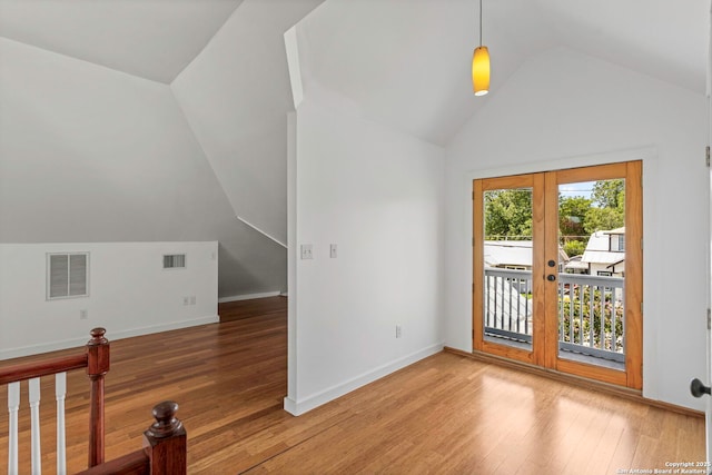 110 Vitra, San Antonio, TX 78210 - empty room featuring vaulted ceiling, light wood-style flooring, and french doors